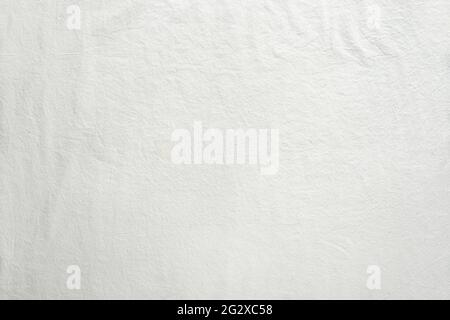 Off white cotton textile background. Flat lay, top view, textured textile backdrop. Copy-space, place for text. Stock Photo