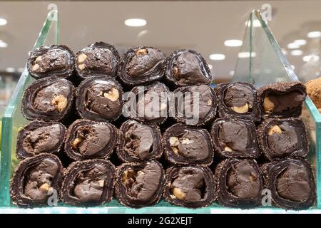 chocolate turkish delights sweets baklava lokum on market in Istanbul, Turkey. Top view blur textures soft focus. Stock Photo