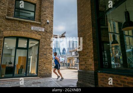 London. UK- 06.10.2021. Pickfords Wharf in Southwark by the bank of Thames river next to the museum ship Goldern Hind and a great view of the City of Stock Photo