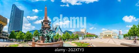 Panoramic cityscape view over Mende Fountain at Augustusplatz in front of the Gewandhaus (Concert Hall), Paulinum, University of church and skyscraper Stock Photo