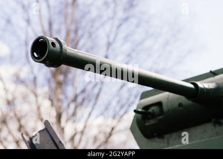 Fragment of a tracked track on a green camouflage tank. Stock Photo