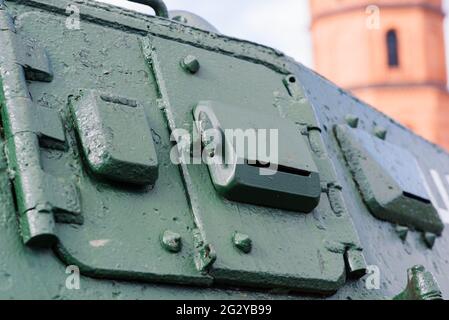 Fragment of a tracked track on a green camouflage tank. Stock Photo