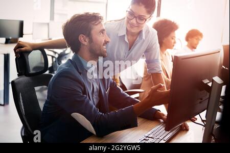 Office with business people working on computers Stock Photo