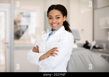 Portrait Of Beautiful Professional Black Female Stomatologist Posing In Clinic Interior Stock Photo