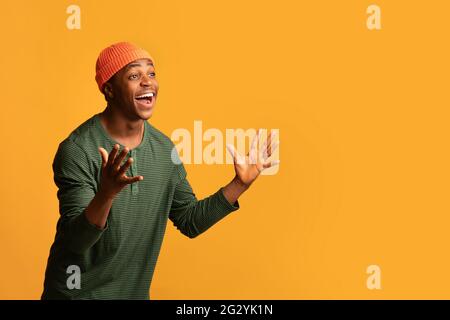 Wow. Portrait Of Amazed African Hipster Guy Exclaiming With Excitement, Stock Photo