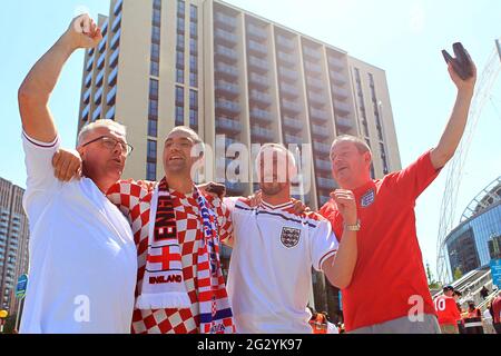 London, UK. 13th June, 2021. England and Croatia fans cheer outside the ground before kick off. Scenes ahead off the UEFA Euro 2020 tournament match, England v Croatia, Wembley Stadium, London on Sunday 13th June 2021. this image may only be used for Editorial purposes. pic by Steffan Bowen/Andrew Orchard sports photography/Alamy Live news Credit: Andrew Orchard sports photography/Alamy Live News Stock Photo