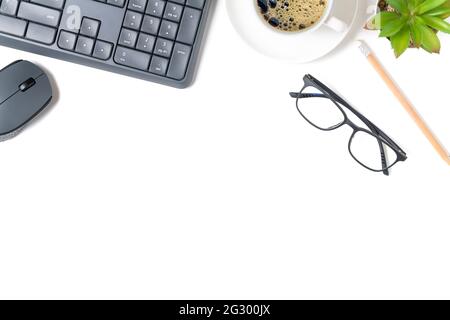White office desk table, computer keyboard and other office supplies with black coffee. Top view with copy space, flat lay. Stock Photo