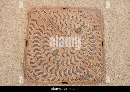 Square iron manhole cover, PAM Inter-Ax 2 manhole cover Stock Photo