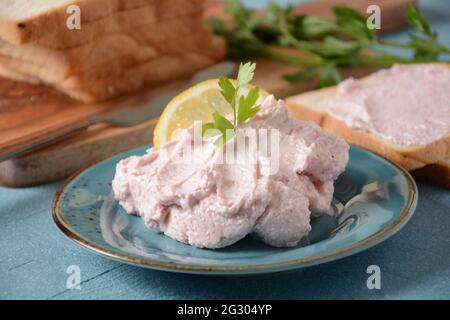 Taramosalata Greek spread Paste (pate) made of ground fish, shrimps, and caviar, served with lemon. Fish Egg Paste Tarama (white and rose), popular Is Stock Photo