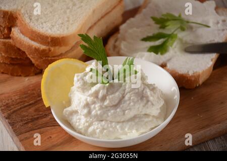 Taramosalata Greek spread Paste (pate) made of ground fish, shrimps, and caviar, served with lemon. Fish Egg Paste Tarama (white and rose), popular Is Stock Photo