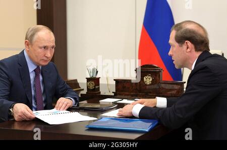 Russian President Vladimir Putin holds a face-to-face meeting with Industry and Trade Minister Denis Manturov from the Novo-Ogaryovo state residence June 10, 2021 outside Moscow, Russia. Stock Photo