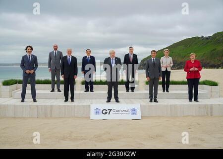 British Prime Minister Boris Johnson, center, poses with leaders of the G7 Summit during the family photo at the Carbis Bay Hotel, June 11, 2021 in Carbis Bay, Cornwall, United Kingdom. Standing from left to right are: Canadian Prime Minister Justin Trudeau, European Council President Charles Michel, U.S President Joe Biden, Japanese Prime Minister Yoshihide Suga, British Prime Minister Boris Johnson, Italian Prime Minister Mario Draghi, French President Emmanuel Macron, European Commission President Ursula von der Leyen and German Chancellor Angela Merkel. Stock Photo