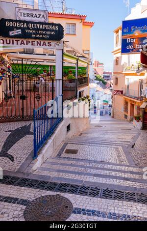 Cobblestone ground on Cuesta del Tajo street, a steep street that goes down to the beach area from the historic center of Torremolinos. Torremolinos, Stock Photo