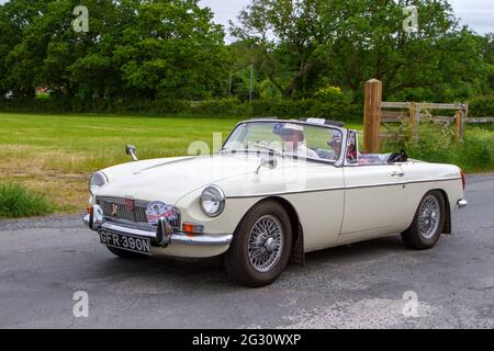 1974 70s white British MG B sports MGB two-door 1798cc sports car at the 58th Annual Classic Car Run arriving at Heskin Hall, Lancashire UK Stock Photo