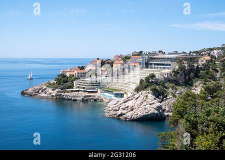 Sailing boat sailing past the Hotel Libertas in Dubrovnik in Croatia Stock Photo