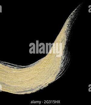 Collection of various hand drawing golden paint brush strokes isolated on black background Stock Photo