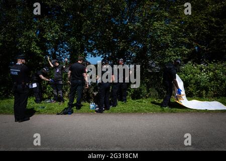 St Ives, UK. 13th June, 2021. Extinction Rebellion protesters are stopped and searched by the police close to the site for G7 Summit. Extinction Rebellion take action for the third and final day of the G7 Summit. Credit: Andy Barton/Alamy Live News Stock Photo