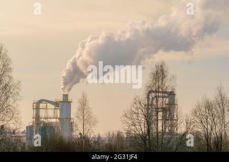 Air pollution by industrial enterprises causes global warming and climate change. Air pollution from industrial plant Stock Photo