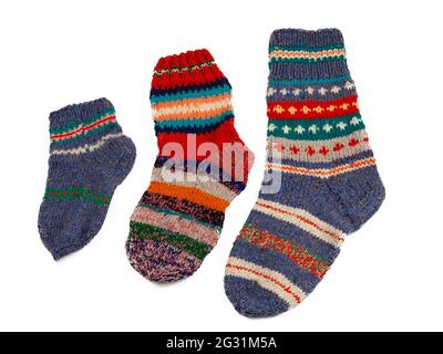 Knitted socks isolated on white background. Warm multi-colored wool sock. Set. Stock Photo