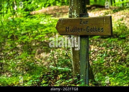 Marked hiking trails in Luxembourg. The sign points to the 'Mother of Christ'