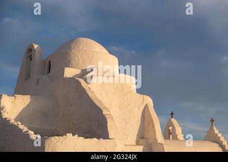 Mykonos island famous church, Panagia Paraportiani at sunset. Cyclades, Greece. Whitewashed chapel, Greek Orthodox Christian religion symbol, tourist Stock Photo