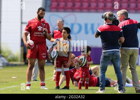 Llanelli, UK. 13th June, 2021. Uzair Cassiem of the Scarlets is interviewed after the game as his children play. Guinness Pro14 Rainbow Cup match, Scarlets v Edinburgh Rugby at the Parc y Scarlets Stadium in Llanelli, South Wales on Sunday 13th June 2021. pic by Andrew Orchard/Andrew Orchard sports photography/Alamy Live news Credit: Andrew Orchard sports photography/Alamy Live News Stock Photo