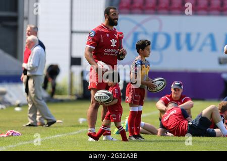 Llanelli, UK. 13th June, 2021. Uzair Cassiem of the Scarlets is interviewed after the game as his children play. Guinness Pro14 Rainbow Cup match, Scarlets v Edinburgh Rugby at the Parc y Scarlets Stadium in Llanelli, South Wales on Sunday 13th June 2021. pic by Andrew Orchard/Andrew Orchard sports photography/Alamy Live news Credit: Andrew Orchard sports photography/Alamy Live News Stock Photo