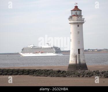 Viking cruise ship leaving Liverpool past Perch Rock Lighthouse New Brighton Stock Photo