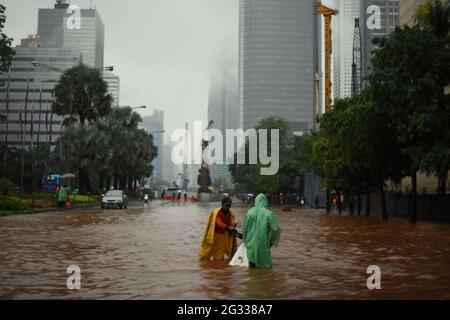 Jakarta, Indonesia. 9th February 2015. Workers of city planning office trying to find if the street's drainage system is clogged, after a continuous rain left Jakarta flooded, on Thamrin Street that stretch across the heart of the Indonesian capital city. Stock Photo