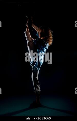 Contemporary dance silhouette artist practicing a dance routine Stock Photo