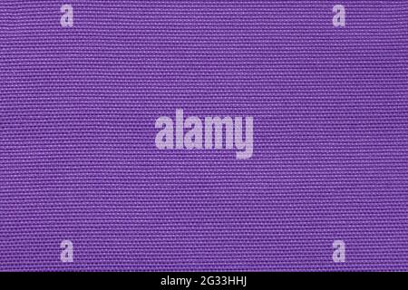 Background image - lilac fabric with a rough texture. Stock Photo