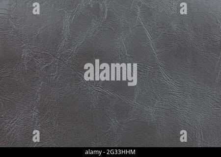 Background image - dark gray leather with textured abstract pattern. Stock Photo