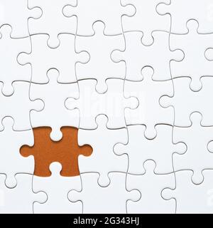 Set of white puzzle pieces and last one piece. blank, copy space Stock Photo