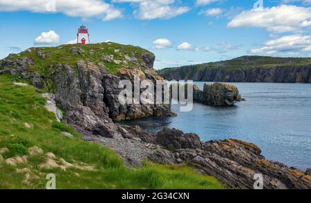 Fort Point Lighthouse near Trinity, Newfoundland, on a mostly sunny day. Stock Photo