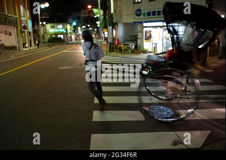 Rickshaws parking their carts at the end of the business day in Kamakura, Japan Stock Photo