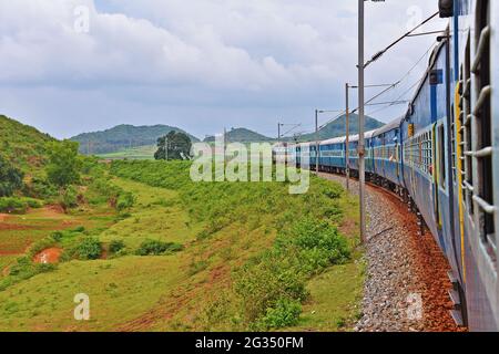 Indian Railways train Kirandul Passenger running through Araku Valley, Andhra Pradesh, India Stock Photo