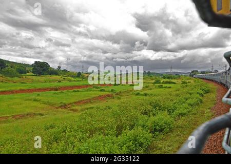 Indian Railways train Kirandul Passenger running through Araku Valley, Andhra Pradesh, India Stock Photo