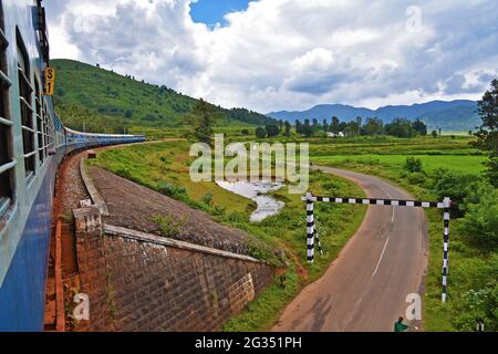 Indian Railways train Kirandul Passenger running through Araku Valley, Andhra Pradesh, India Stock Photo