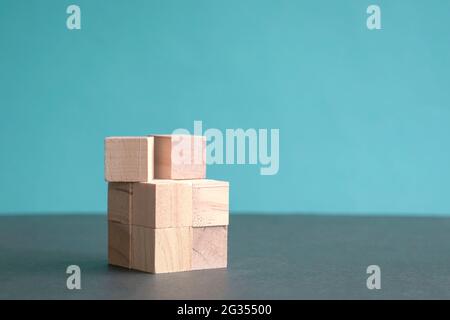 Wooden blocks on blue background. Copy space. Stock Photo