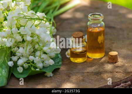 Lily of the valley essential oil in a small bottle. Selective focus. Nature  Stock Photo - Alamy