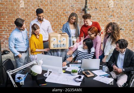 Group of entrepreneurs architects having fun indoors in office, working on project. Stock Photo
