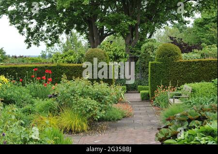 WOLLERTON, SHROPSHIRE / UNITED KINGDOM - 22 MAY 2014: The garden at Wollerton Old Hall Stock Photo