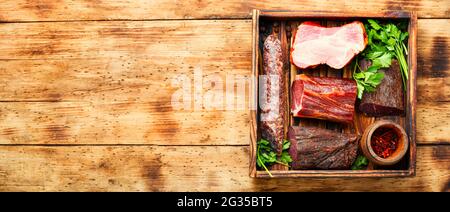 Spanish meat platter.Cured meat and sausages on cutting board.Space for text Stock Photo
