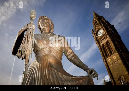 Grade I listed Manchester, Rochdale town hall clocktower and Dame Gracie Fields statue by sculptor Sean Hedges-Quinn Stock Photo