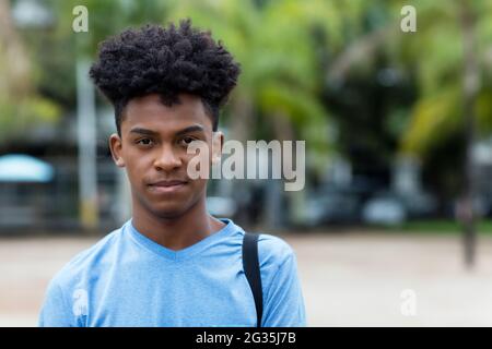 Serious black man from Brazil in city in summer Stock Photo