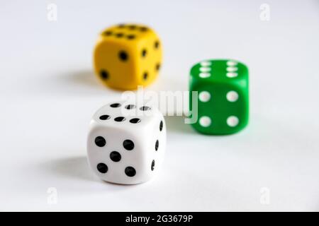 Three colorful dices isolated on white background. Top view Stock Photo