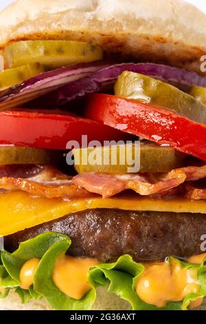 Beef burger with bacon isolated on white background Stock Photo