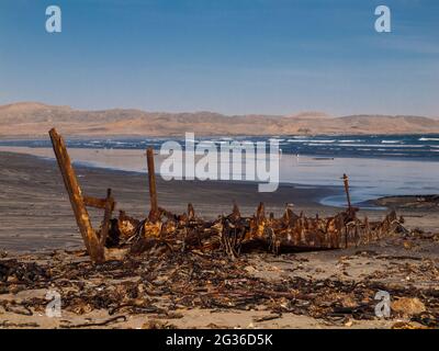 Devasted ship wreck on the beach Stock Photo