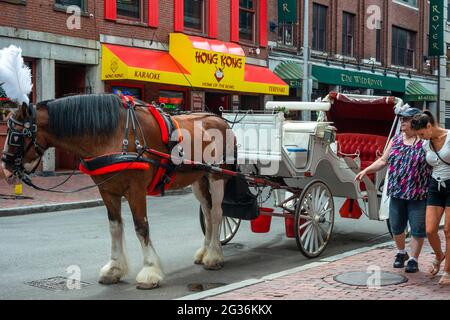Boston horse carriage tour near Quincy Market and Faneuil Hall in Freedom Trail Boston Massachusetts. Built in early 1800s as one of the largest marke Stock Photo