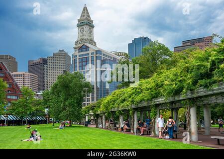 Custom House Tower The Financial District from Christopher Columbus Park, Boston, Massachusetts, USA.  Green grass park ground at Christopher Columbus Stock Photo